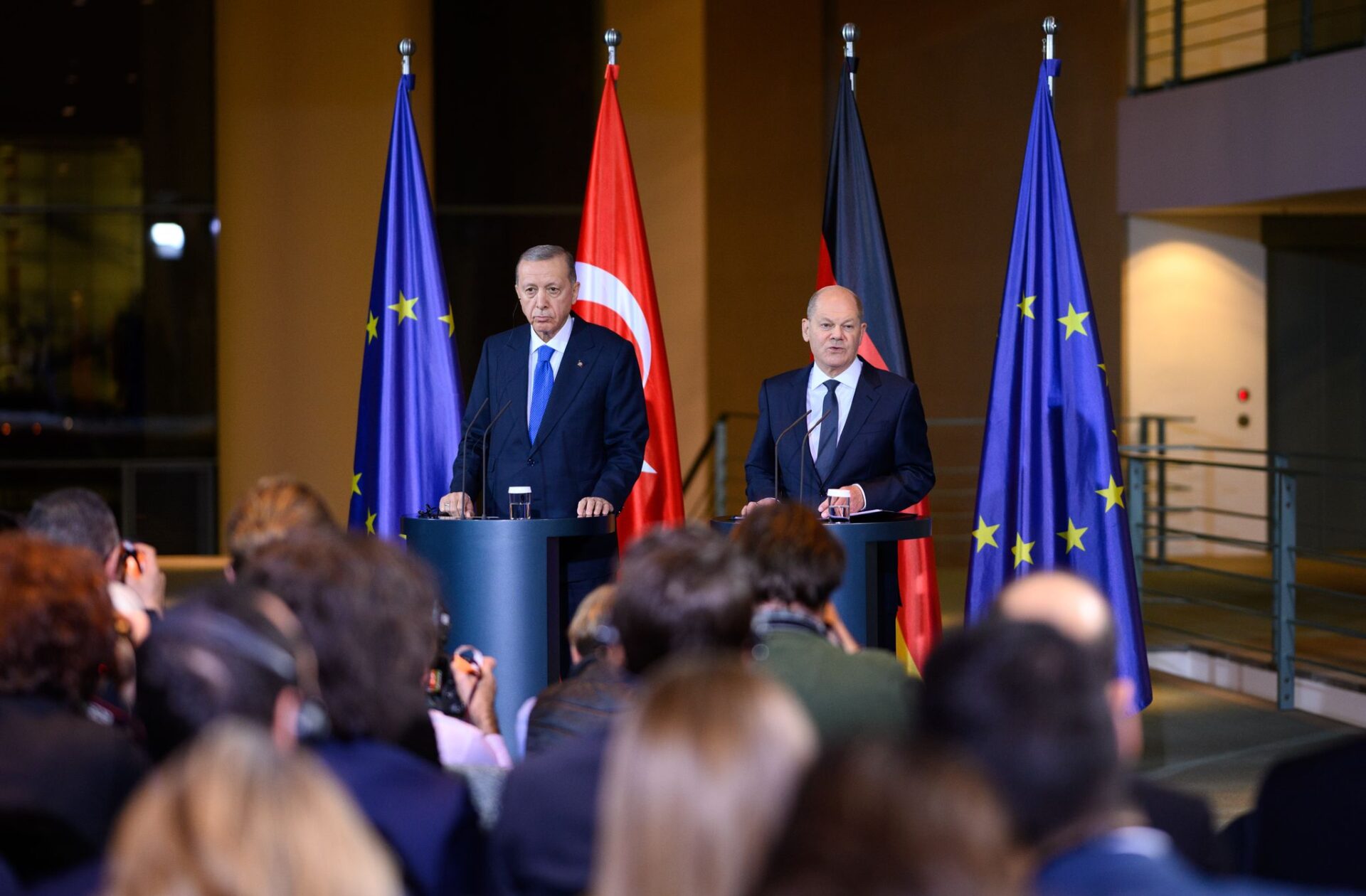 German Chancellor Olaf Scholz (R) and Turkish President Recep Tayyip Erdogan speak at a press conference ahead of their meeting and dinner at the Federal Chancellery.