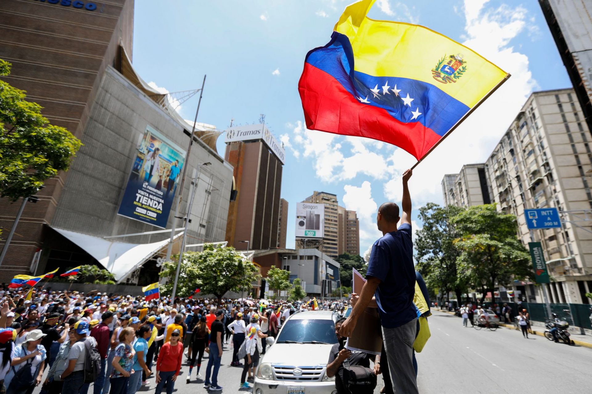 Demonstrators take part in a rally with Venezuelan flags. The opposition had called for the demonstration to protest against President Maduro after the election.