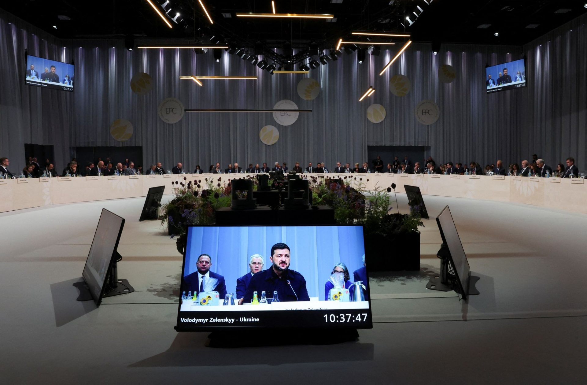 A screen displays Ukrainian President Volodymyr Zelensky speaking during the 7th European Political Community (EPC) Summit at the Bella Center in Copenhagen
