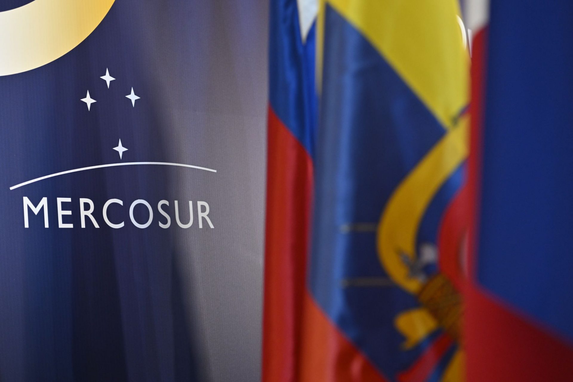 The Mercosur logo can be seen on a wall behind flags of the Mercosur member states on the sidelines of the summit of the economic alliance. Negotiators from EU countries and the European Parliament have agreed on new safeguards for imported agricultural products under the pending Mercosur free trade agreement, despite persisting divisions over the approval of the deal with four Latin American countries.